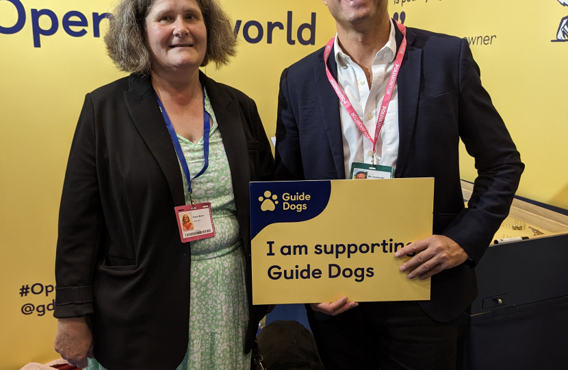 Ben Everitt MP with Elaine and her guide dog Inca at Conservative Party Conference 2023