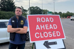 Ben Everitt MP at the closure sign for the A509