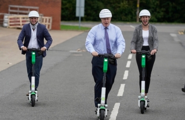 Ben with the PM on the Lime e-scooters in MK