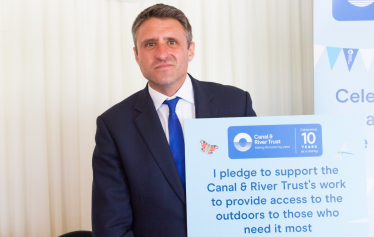 Ben Everitt MP Holding A Canal And River Trust Placard