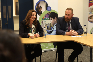 Gillian Keegan with headteacher Ian Tett speaking to students at Oakgrove School